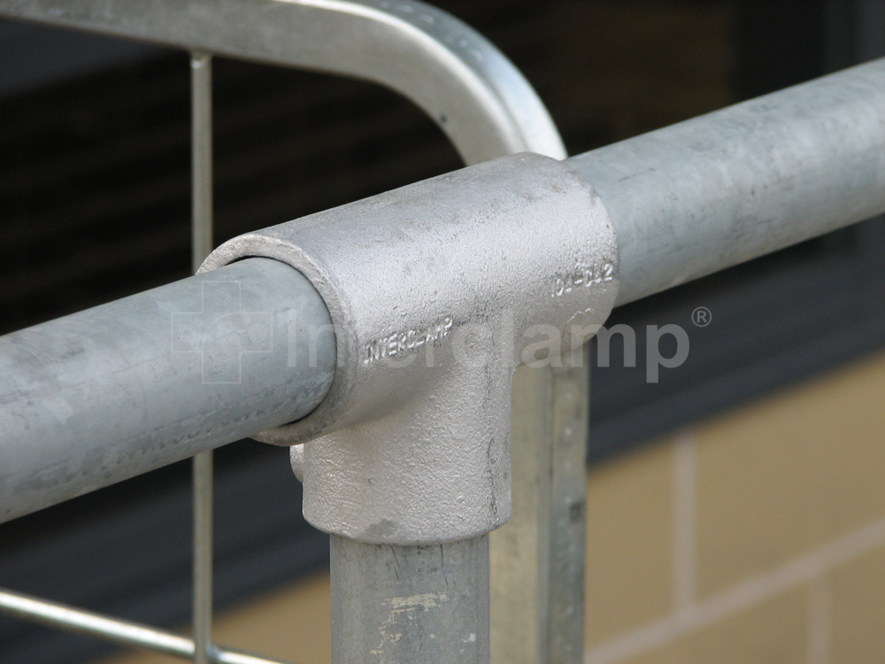 Close up of a galvanised Interclamp tube clamp long tee